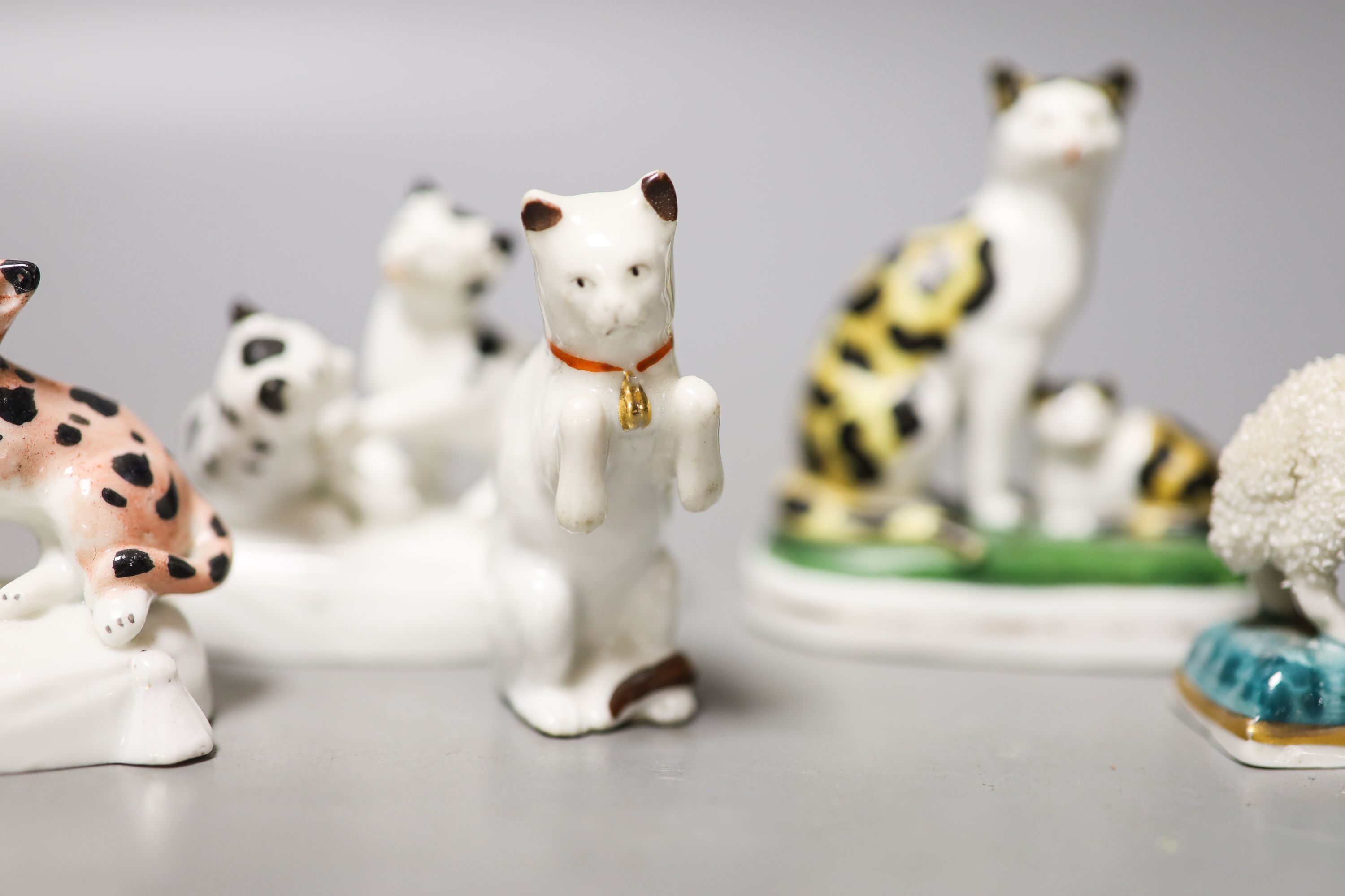 Six French porcelain cat figures or groups, and a similar sheep figure, late 19th century